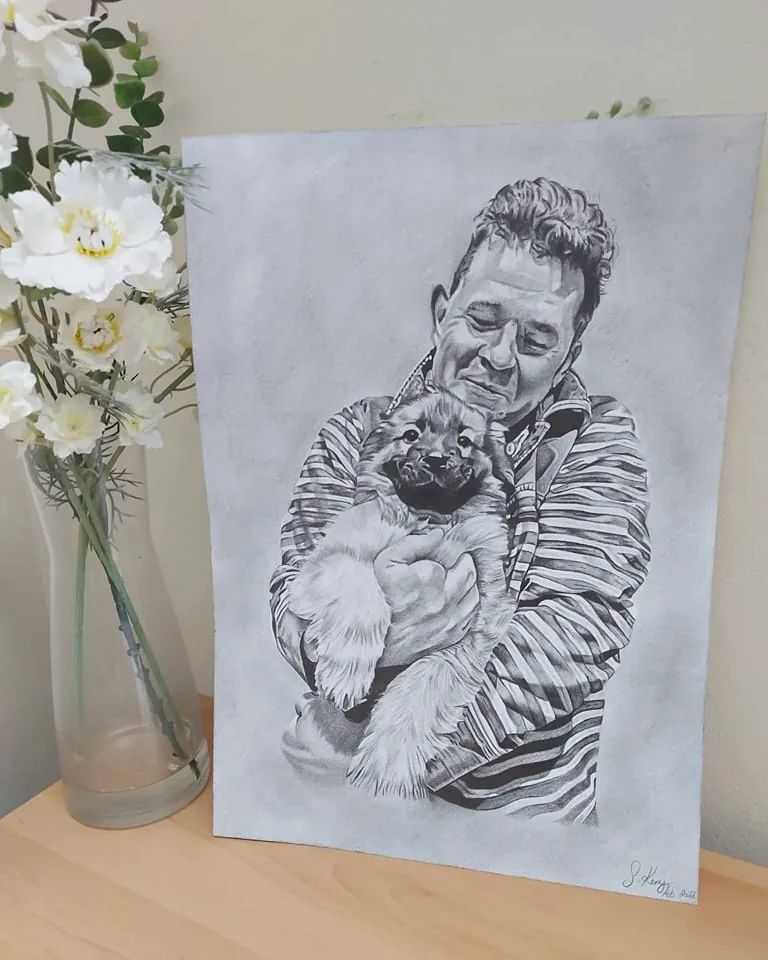 Pencil portrait of man and dog