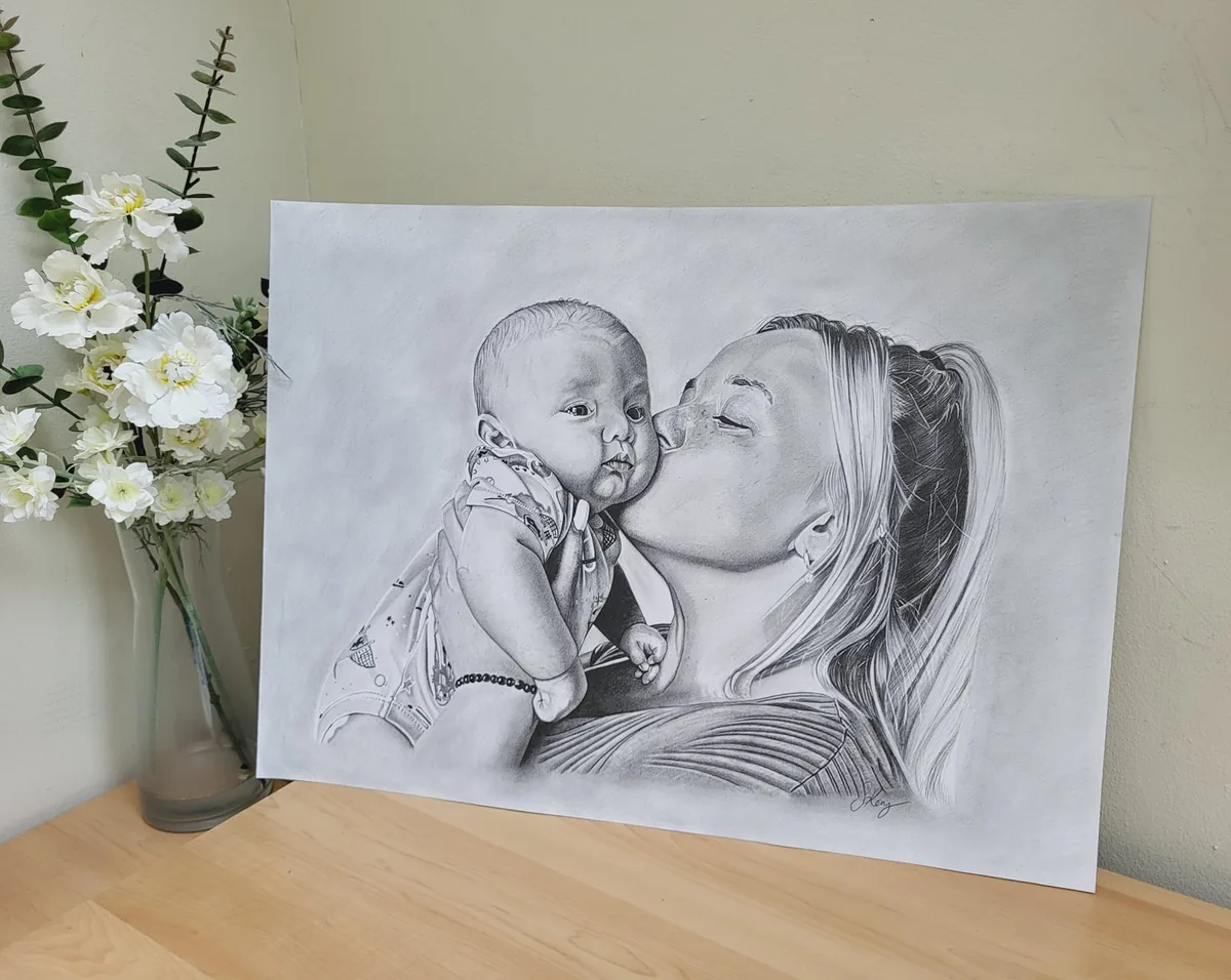 Hand-drawn pencil portrait of a mother and child